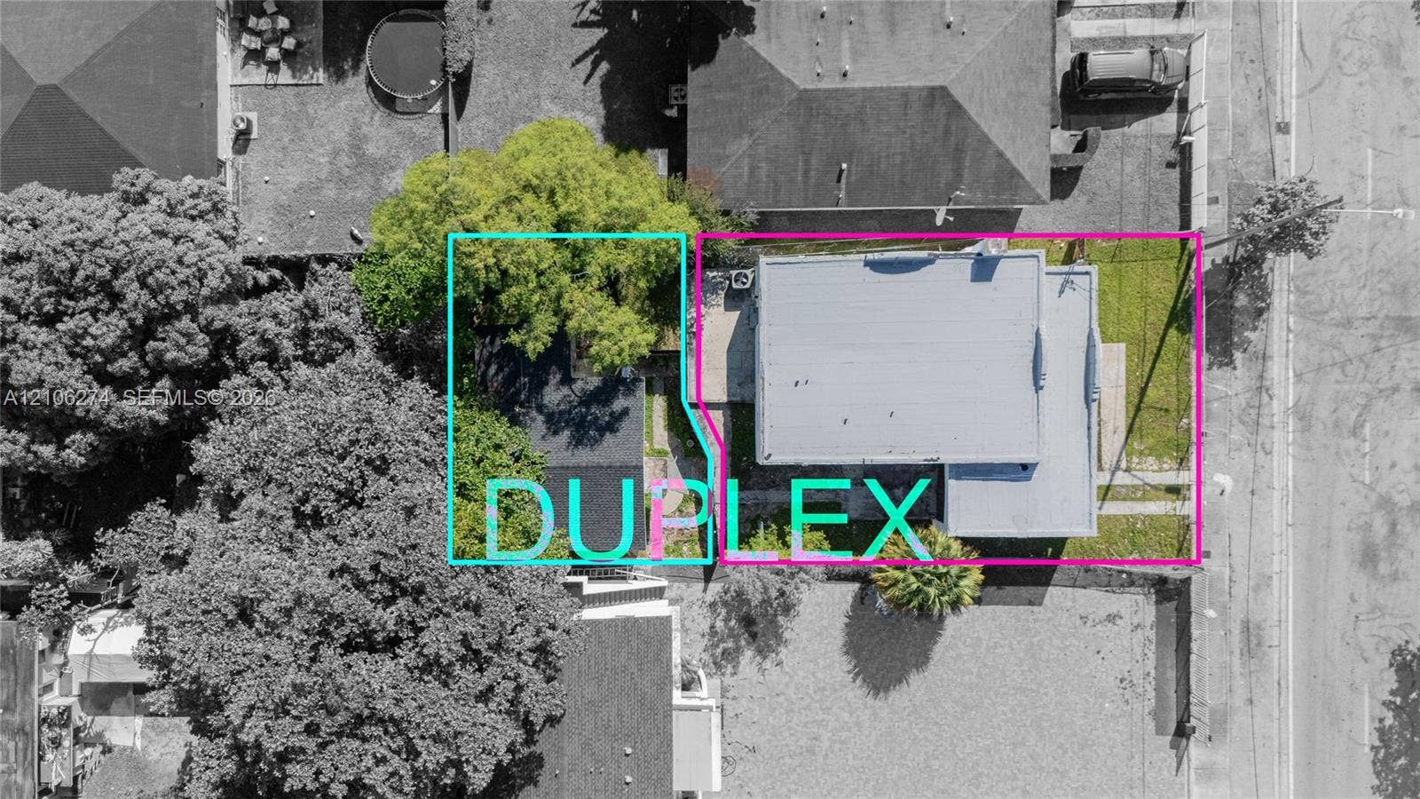 1601 NW 50th Street, Miami, FL 33142 Aerial perspective of a duplex property featuring mature trees, a concrete walkway, and dedicated outdoor space