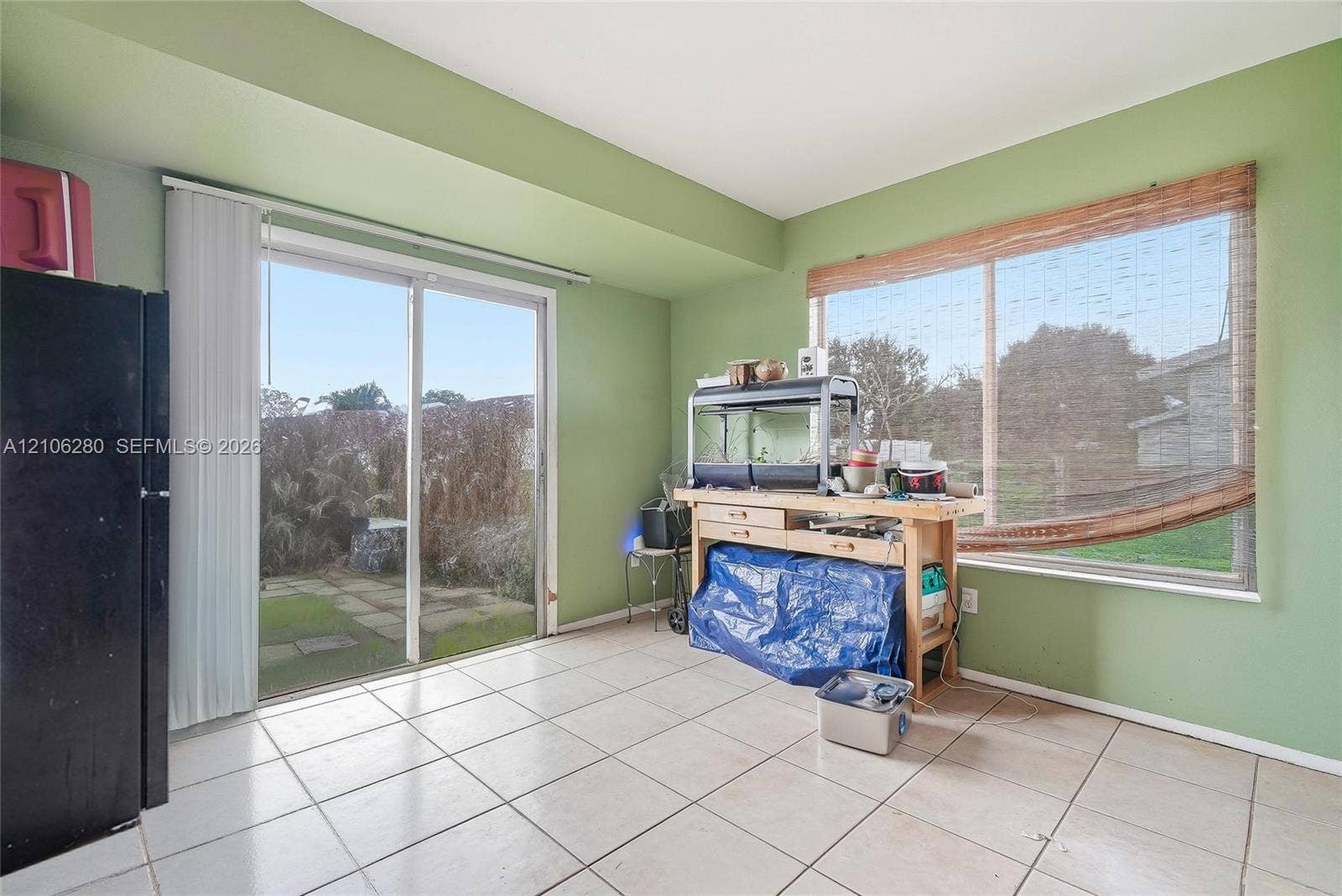 2017 SE Ancora Court, Port St Lucie, FL 34952 Ceramic tile flooring, sliding glass door, and large picture window
