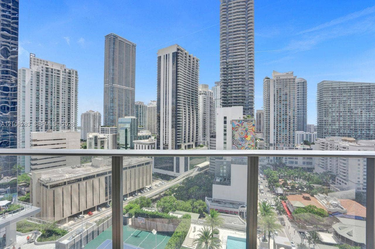 801 S Miami Avenue, #1801, Miami, FL 33130 Balcony with a brushed metal and glass railing, featuring an expansive urban skyline panorama