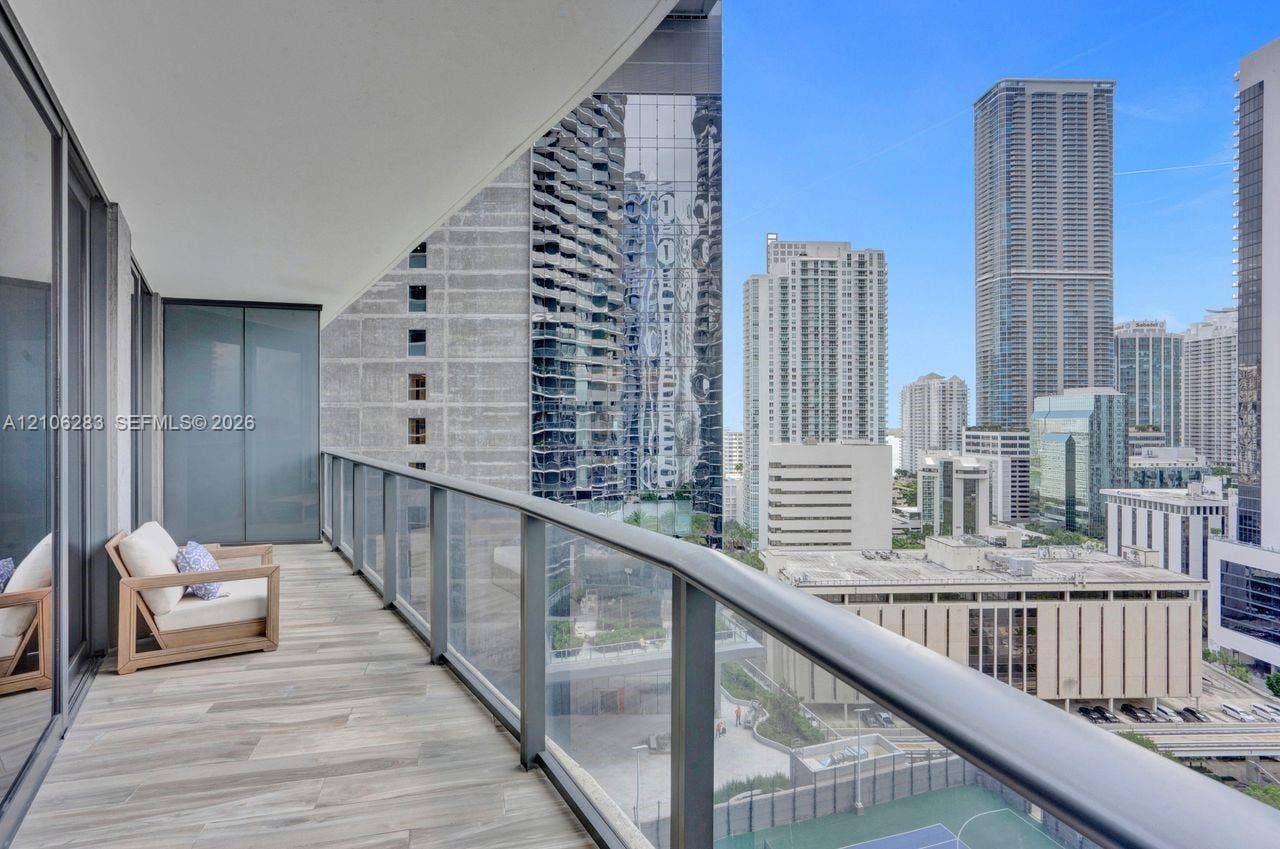 801 S Miami Avenue, #1801, Miami, FL 33130 Covered balcony featuring tile flooring, metal railings, and glass partition panels