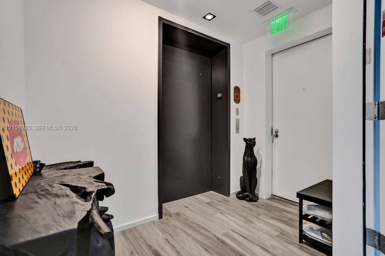 801 S Miami Avenue, #1801, Miami, FL 33130 Entrance featuring wood-finish flooring, a matte black elevator door, and recessed ceiling lighting