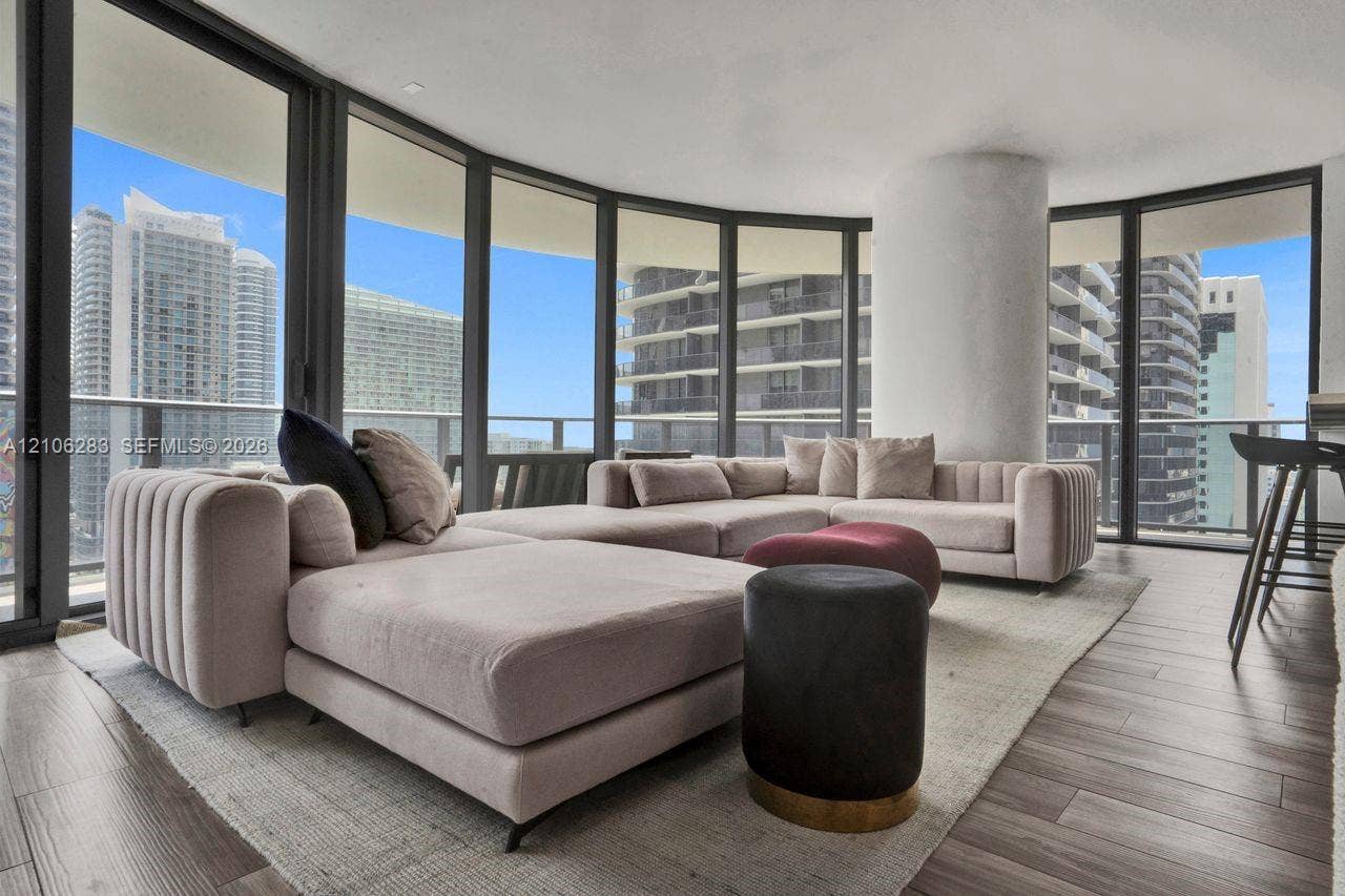 801 S Miami Avenue, #1801, Miami, FL 33130 Floor-to-ceiling glass walls, wrap-around balcony access, wood-finish flooring, and structural column