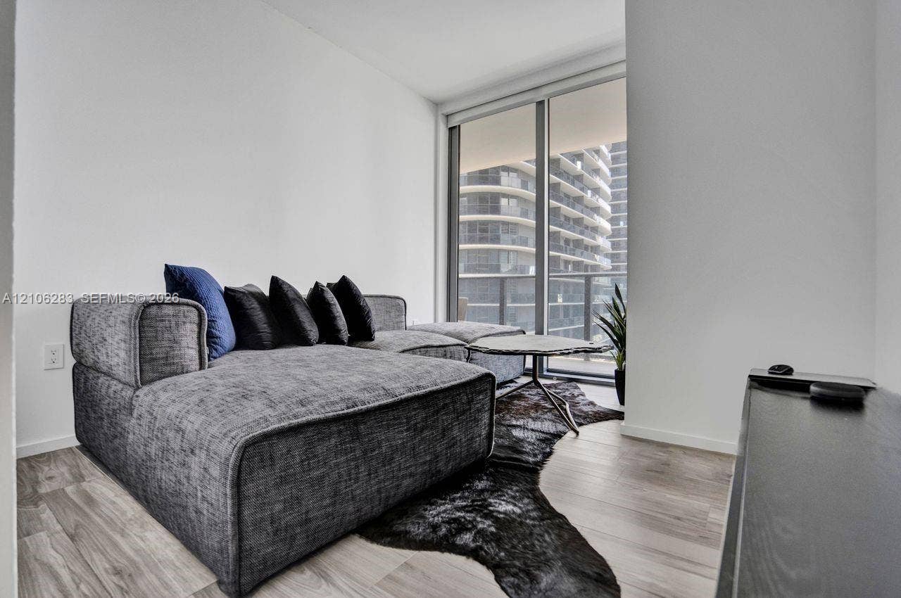 801 S Miami Avenue, #1801, Miami, FL 33130 Floor-to-ceiling windows featuring a metal frame and light wood-finish flooring
