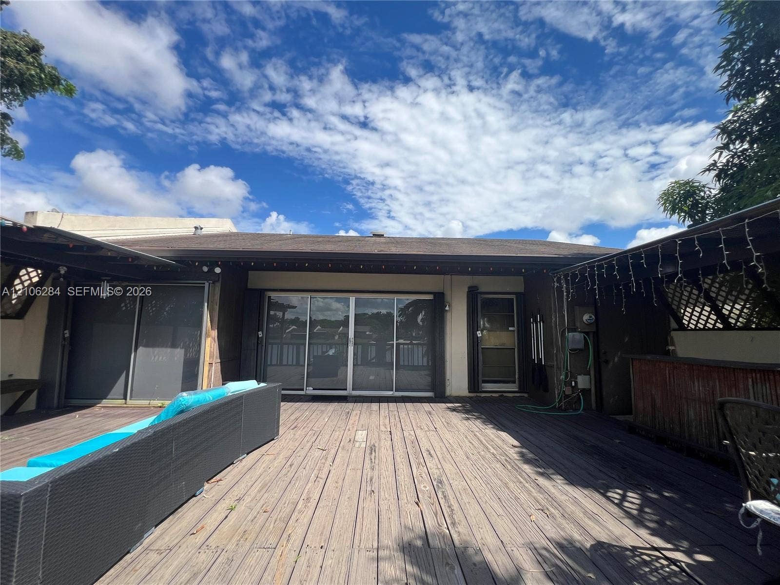 11824 SW 123rd Avenue, #., Miami, Miami, FL 33186 Spacious wooden deck featuring sliding glass doors and covered patio areas