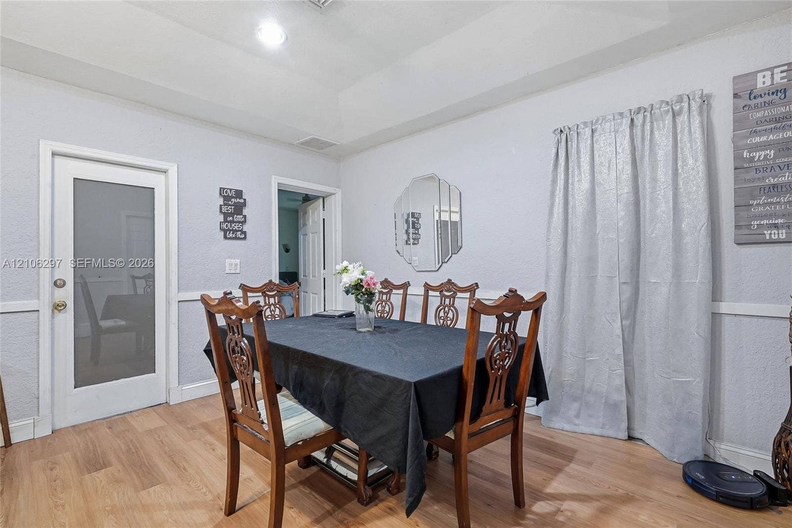 4810 Lakewood Park Drive, Fort Pierce, FL 34951 Tray ceiling, wood-finish flooring, and a single-light frosted glass exterior door with brushed metal hardware