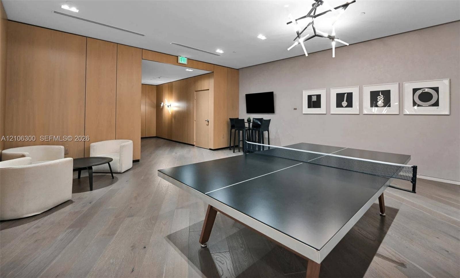 480 NE 31st Street, #1005, Miami, Miami, FL 33137 Interior space featuring wood-paneled walls, wood-finish flooring, recessed lighting, and a modern geometric ceiling fixture