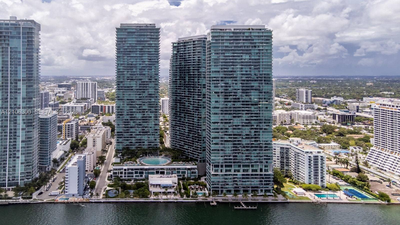 480 NE 31st Street, #1005, Miami, Miami, FL 33137 High-rise residential towers featuring glass-curtain wall construction, waterfront location, and multi-level outdoor podium pool area
