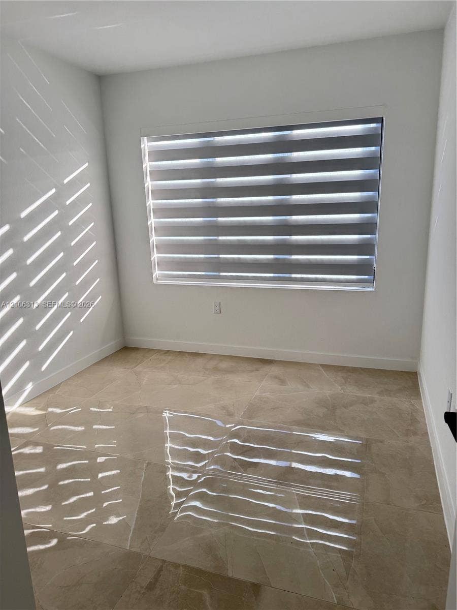 14508 SW 260th Street, #14508, Homestead, Homestead, FL 33032 Neutral-toned large format tile flooring and crisp white wall finishes