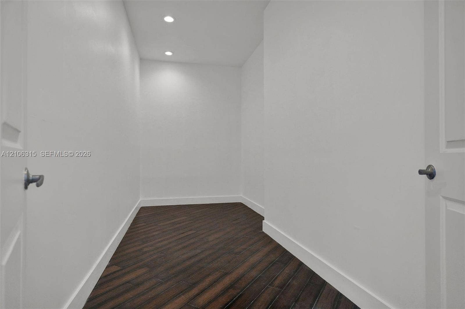 2319 NE 35th Drive, Fort Lauderdale, FL 33308 Interior space featuring wood-finish flooring, white walls, and recessed ceiling lighting