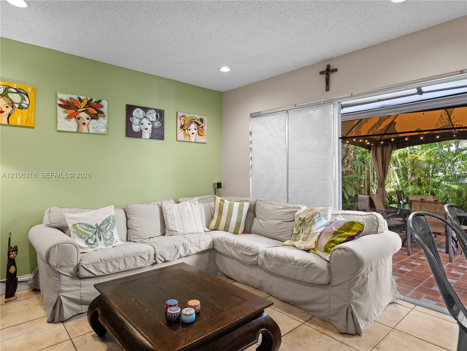 9921 NW 51st Lane, Doral, FL 33178 Ceramic tile flooring, recessed ceiling lighting, and expansive sliding glass doors providing outdoor access