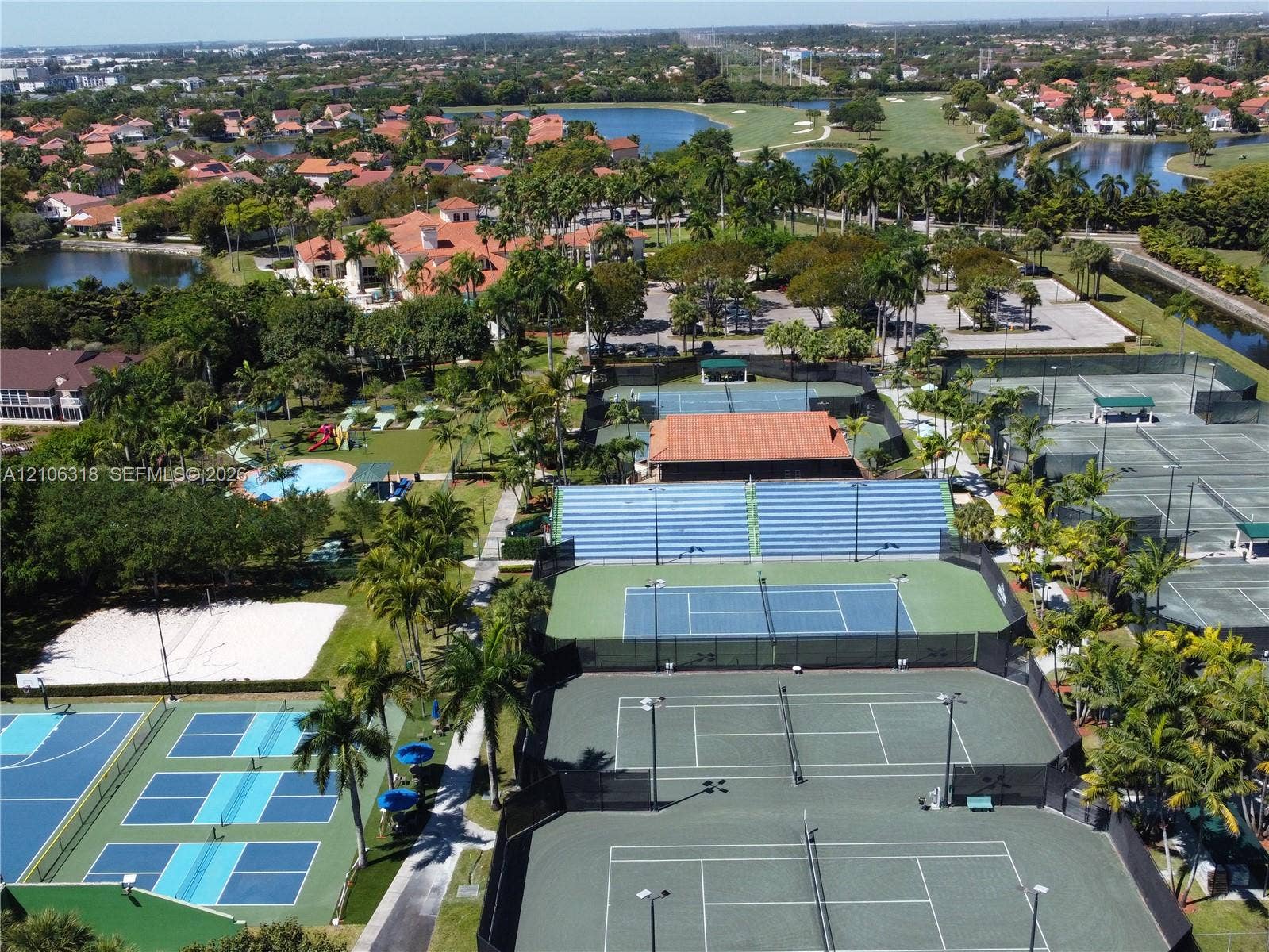 9921 NW 51st Lane, Doral, FL 33178 Doral Country Club is a recreational complex featuring multiple tennis courts, pickleball courts, a swimming pool, and landscaped surroundings