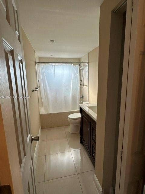 220 NW 87th Avenue, #K212, Miami, Miami, FL 33172 Bathroom featuring large-format tile flooring, a dark wood-finish vanity with a white countertop, and a shower-tub combination with light-toned wall tile
