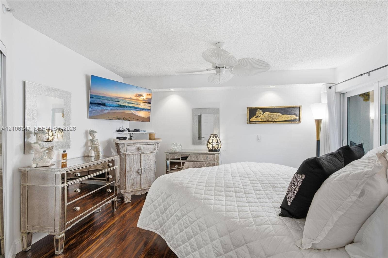 7759 Granville Drive, #306, Tamarac, FL 33321 Wood-finish flooring, recessed ceiling lighting, and a white multi-blade ceiling fan