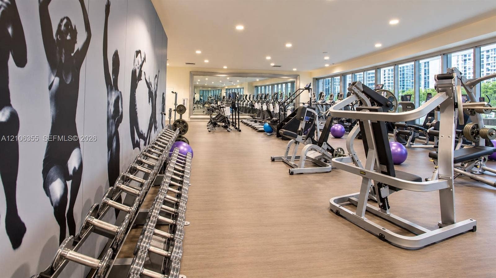 495 Brickell Avenue, #1906, Miami, Miami, FL 33131 Fitness center featuring floor-to-ceiling windows, wood-finish flooring, recessed lighting, and a full-length wall mirror