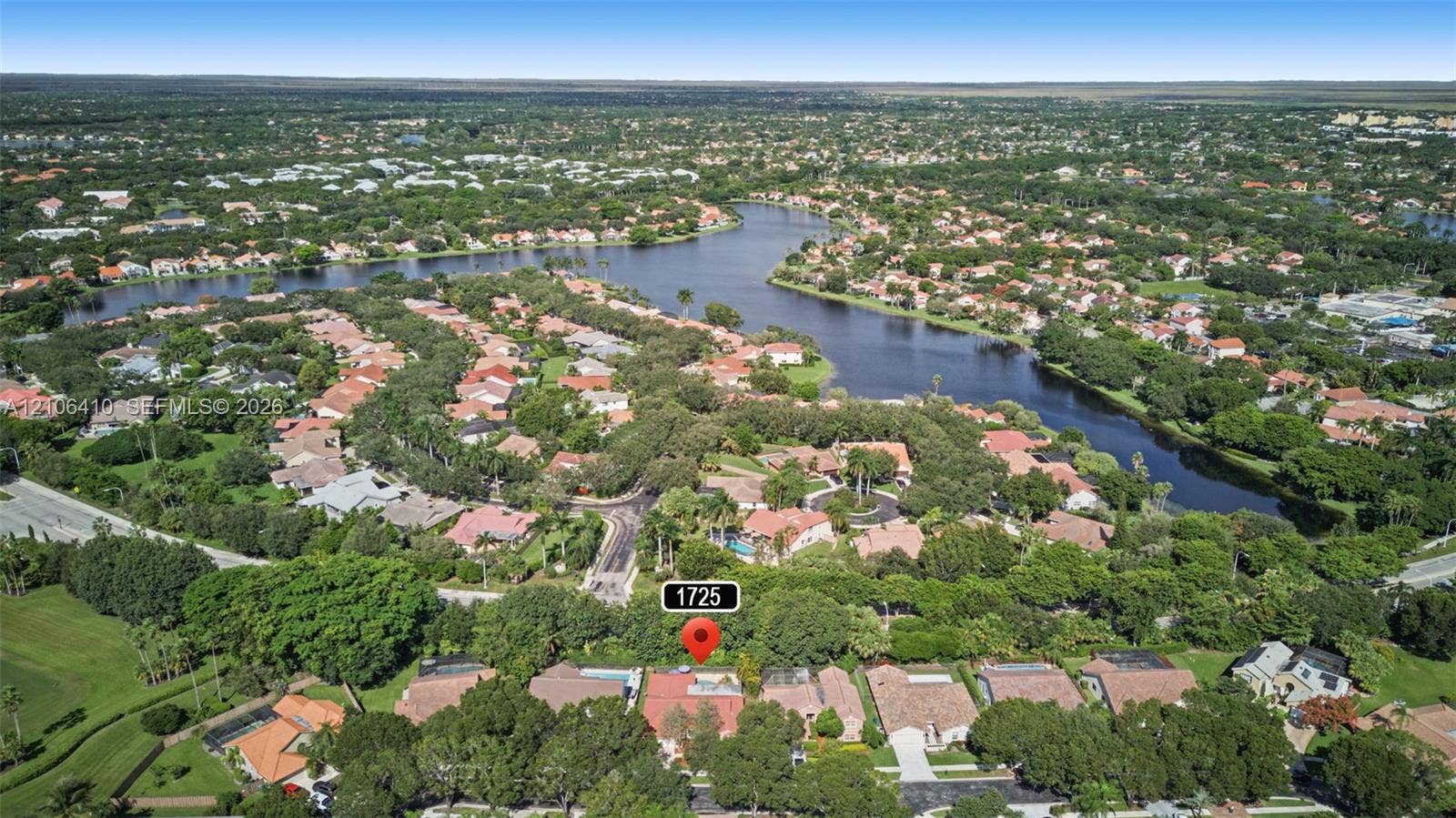 1725 Lakeshore Circle, Weston, FL 33326 Aerial perspective of property featuring mature trees and expansive landscape