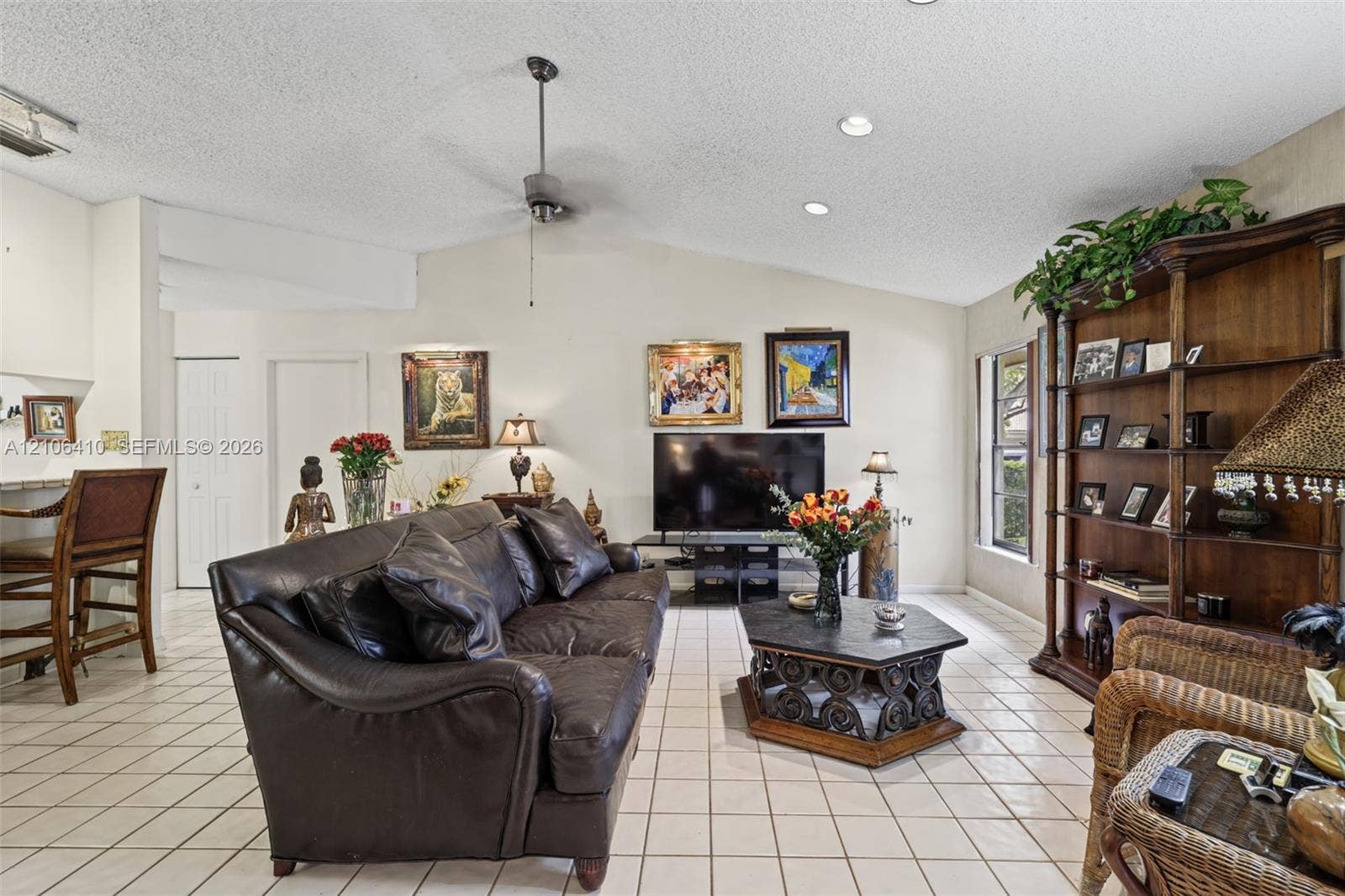 1725 Lakeshore Circle, Weston, FL 33326 Living room featuring vaulted ceilings, recessed lighting, a ceiling fan, and ceramic tile flooring