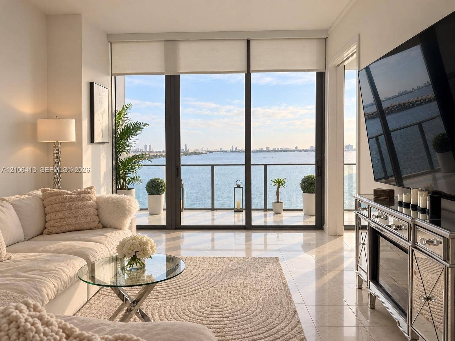 480 NE 31st Street, #1404, Miami, FL 33137 Floor-to-ceiling windows, polished tile flooring, and a private balcony featuring metal railings