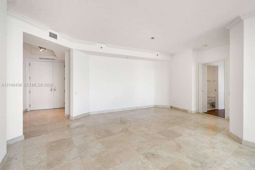 808 Brickell Key Drive, #2102, Miami, Miami, FL 33131 Open interior featuring stone tile flooring, crown molding, and recessed lighting