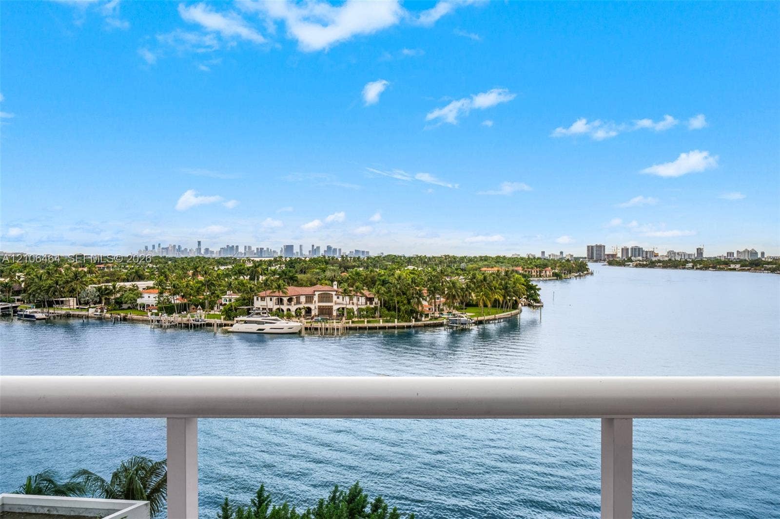 6770 Indian Creek Drive, #8E, Miami Beach, FL 33141 Elevated balcony featuring a tubular metal railing with expansive water, coastline, and skyline scenery