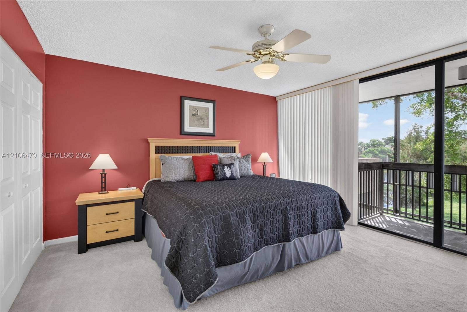 2800 SW 87th Avenue, #1113, Davie, FL 33328 Floor-to-ceiling sliding glass doors, private balcony, ceiling fan with light kit, and double-door closet