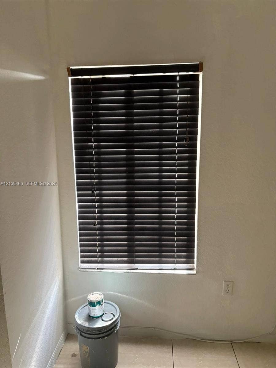 117 SE 3rd Avenue, #7, Hallandale Beach, FL 33009 Window featuring dark-toned horizontal blinds and tile flooring