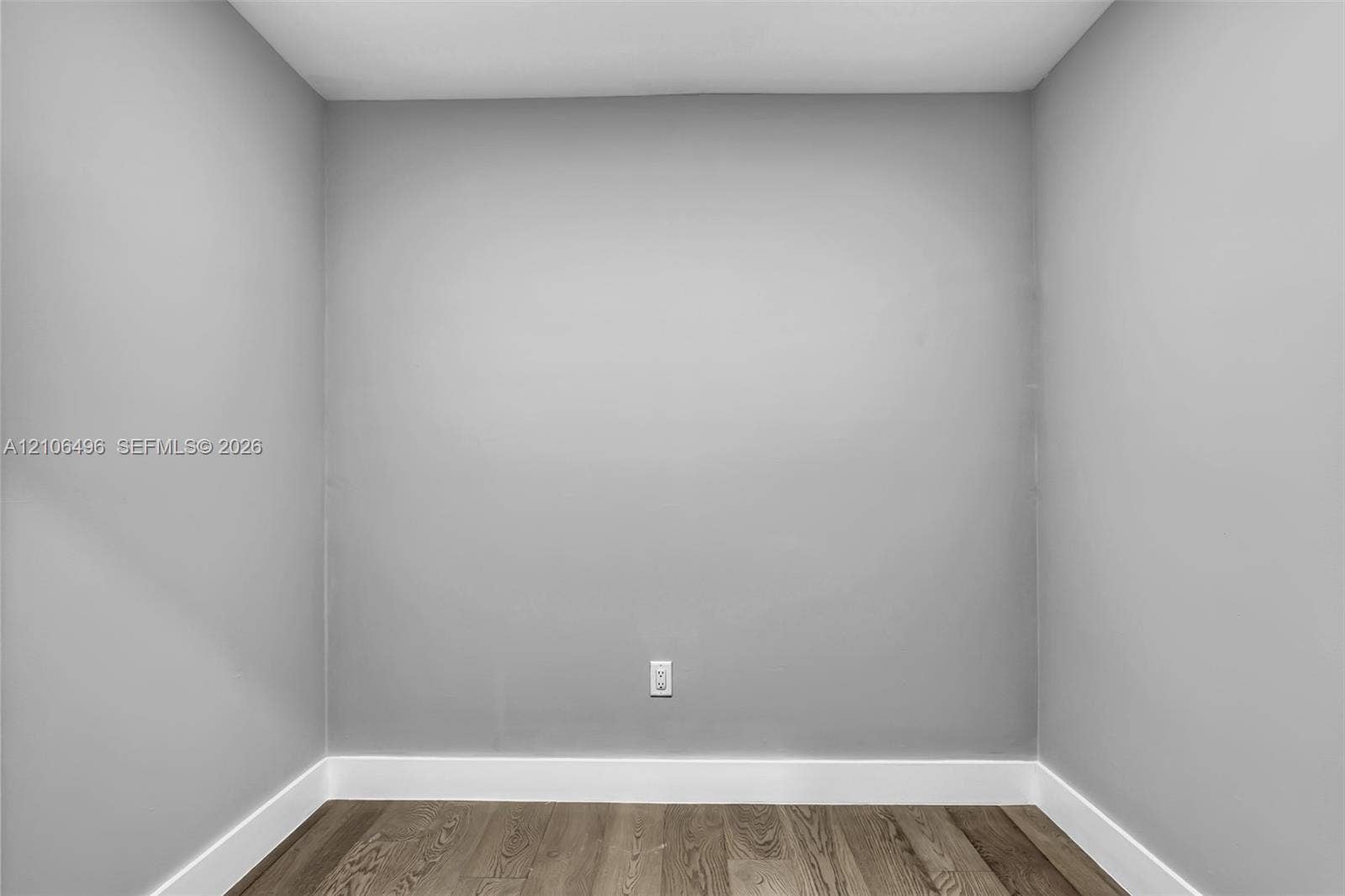 Neutral-toned walls and wood-finish flooring