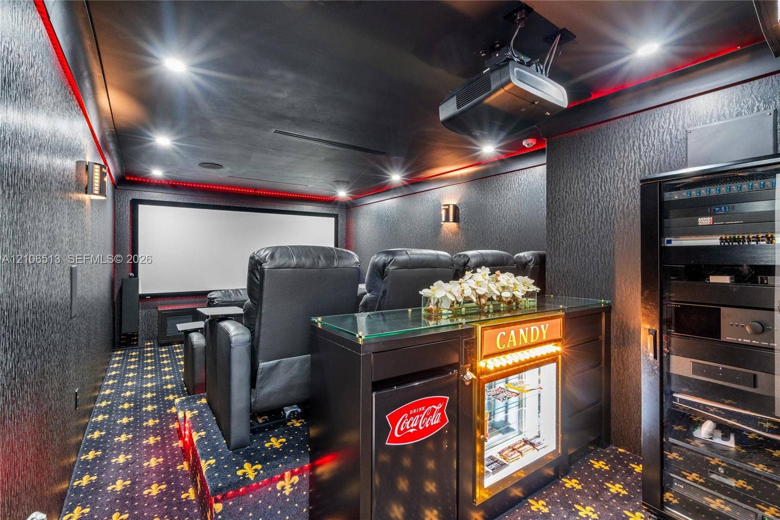 5720 SW 128th Street, Pinecrest, FL 33156 Dedicated media room featuring a large projection screen, recessed lighting, integrated ceiling-mounted projection equipment, and a built-in equipment rack