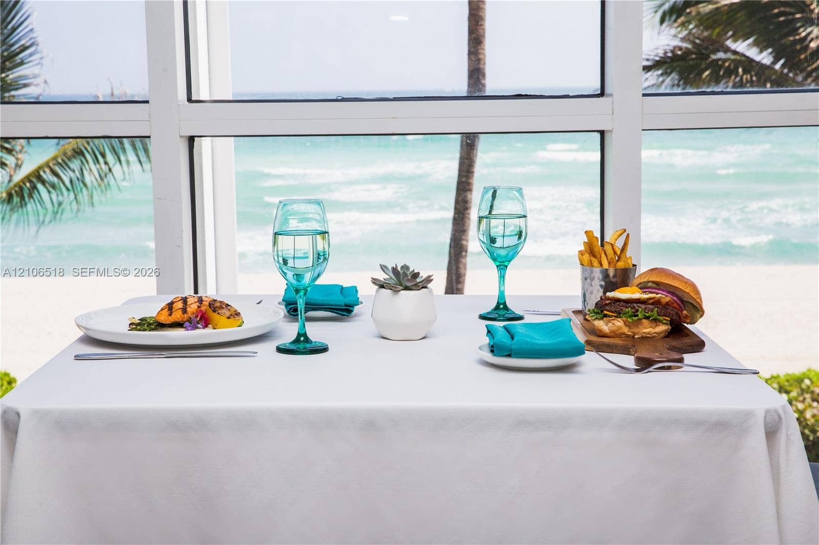16500 Collins Avenue, #554, Sunny Isles Beach, FL 33160 Floor-to-ceiling multi-pane windows with clear ocean and beach scenery