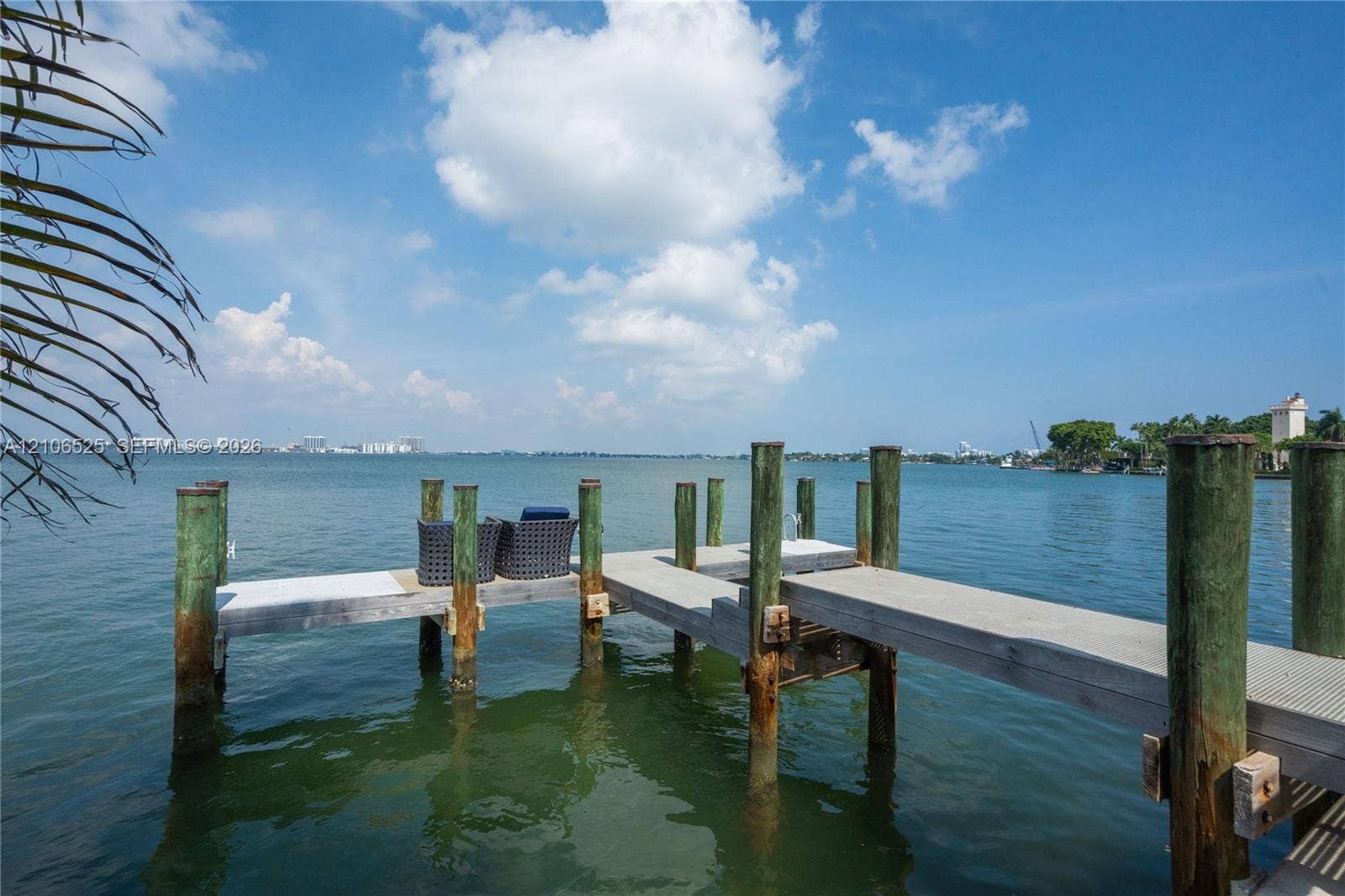 4760 N Bay Road, Miami Beach, FL 33140 Private wooden pier featuring pilings and extended dock space extending into the water