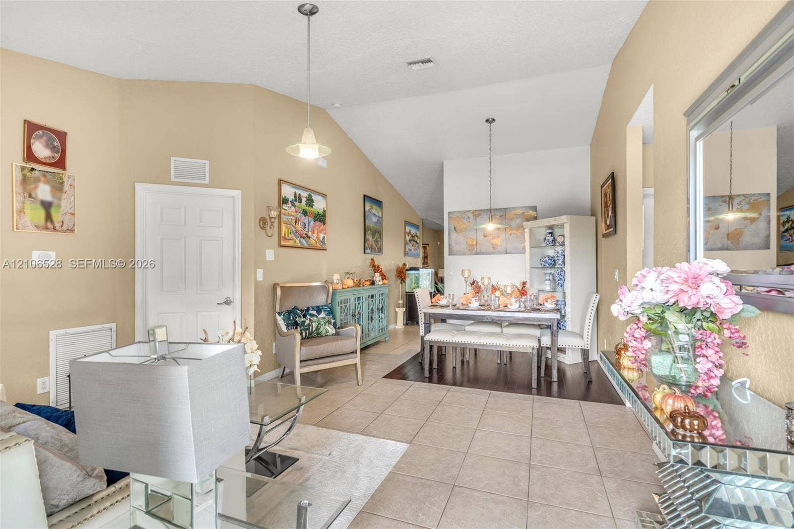 2615 NW 14th Street, Fort Lauderdale, FL 33311 Vaulted ceilings, large-format tile flooring, dual pendant lighting fixtures, and recessed wall niches