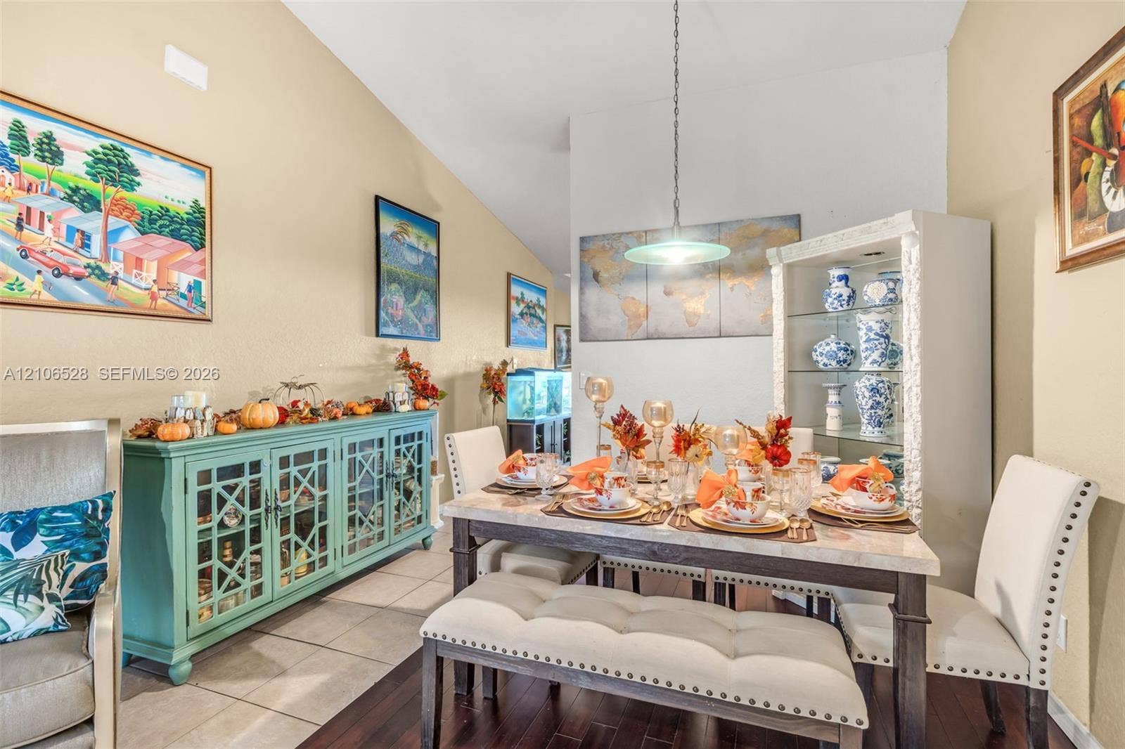 2615 NW 14th Street, Fort Lauderdale, FL 33311 Vaulted ceiling, decorative pendant light fixture, and tile flooring