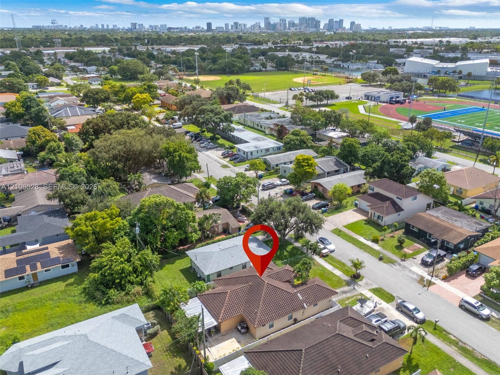 2615 NW 14th Street, Fort Lauderdale, FL 33311 Aerial view featuring a residential property with a tiled roof, situated on a corner lot with mature landscaping