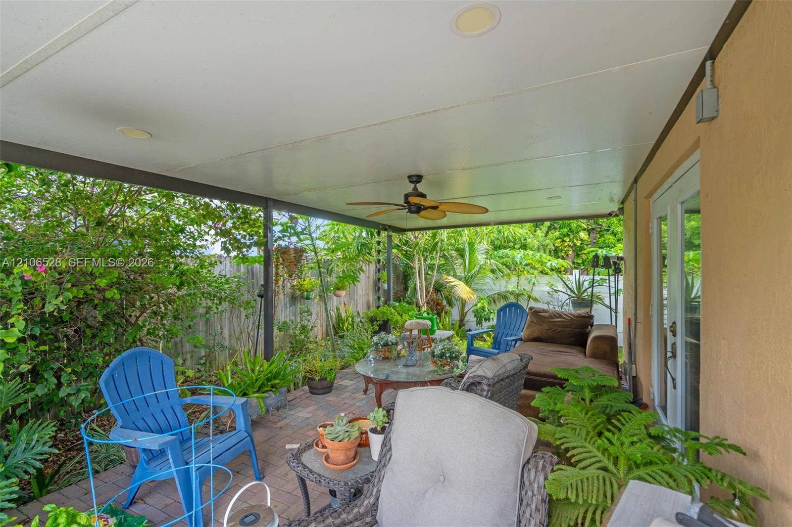 2615 NW 14th Street, Fort Lauderdale, FL 33311 Covered outdoor patio featuring brick pavers, a ceiling-mounted fan, recessed lighting, and glass-paneled double doors