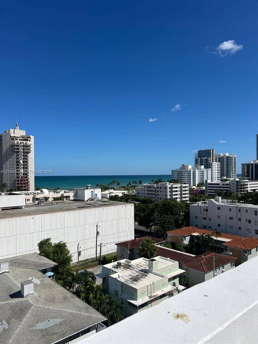 6801 Indian Creek Drive, #509, Miami Beach, FL 33141 Panoramic ocean horizon and urban skyline featuring high-rise buildings and tropical landscaping