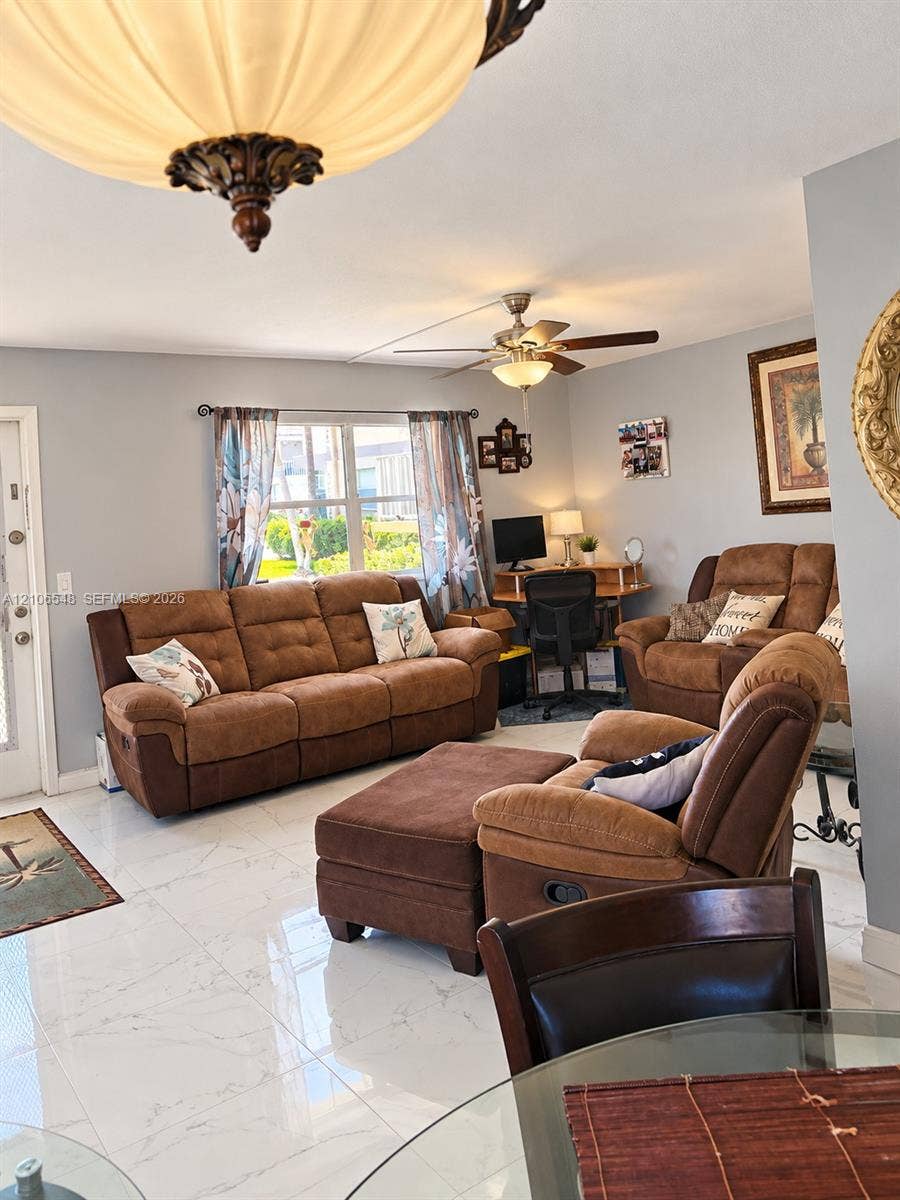 Polished porcelain tile flooring, decorative semi-flush mount ceiling fixture, and multi-speed ceiling fan with integrated lighting