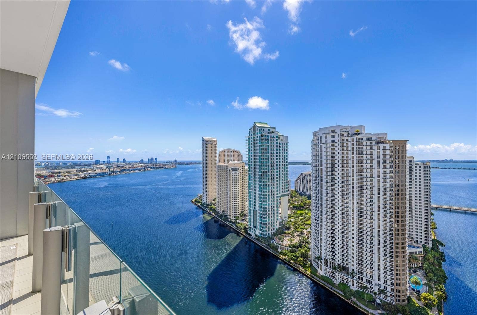 300 Biscayne Boulevard Way, #3002E, Miami, FL 33131 Private balcony featuring glass panel railing and tile flooring, capturing coastal waterway scenery and urban skyline