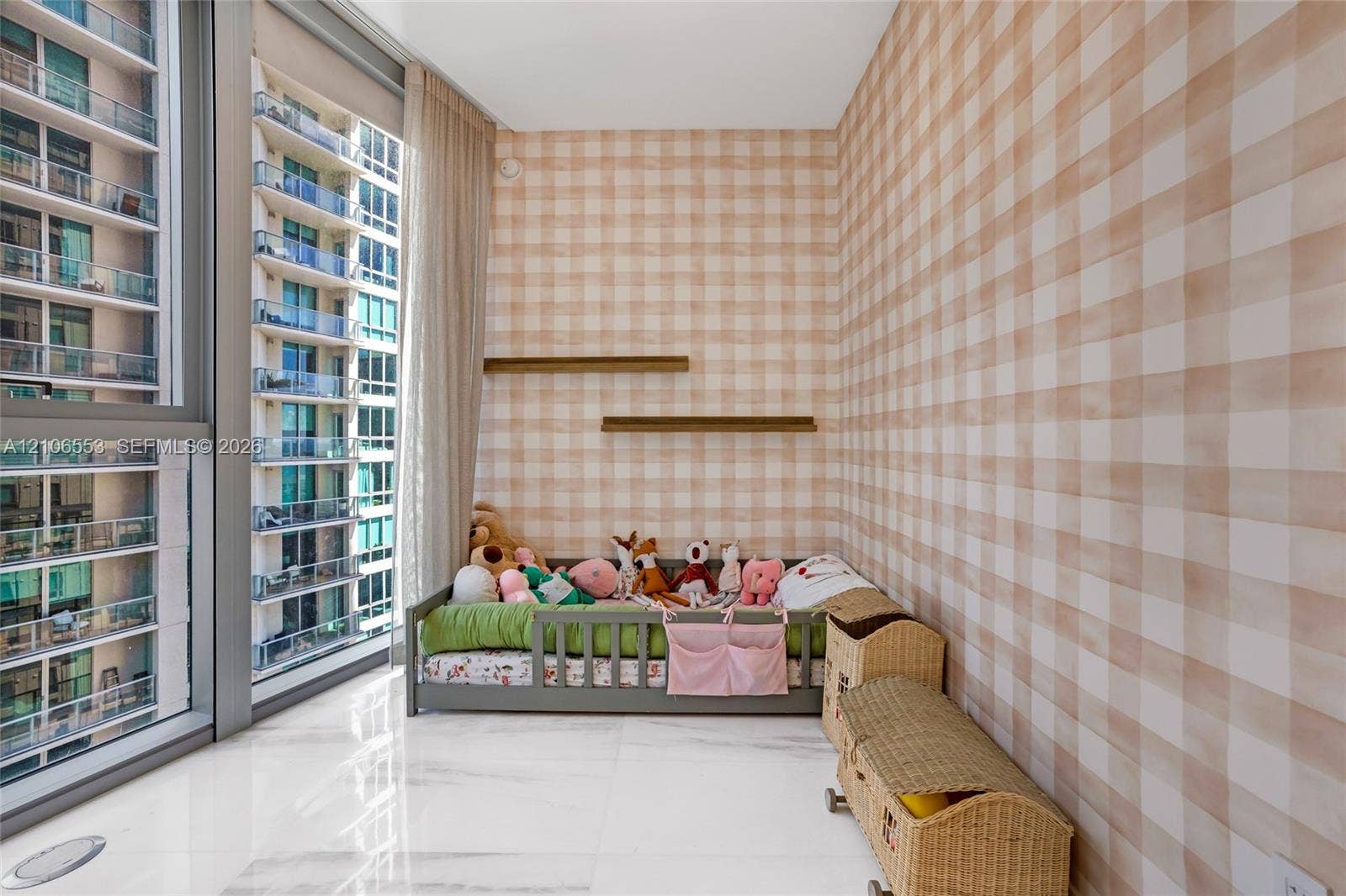 300 Biscayne Boulevard Way, #3002E, Miami, FL 33131 Floor-to-ceiling windows with expansive glass panels, light-toned check-patterned wall covering, dual built-in wall shelves, and polished stone-finish tile flooring