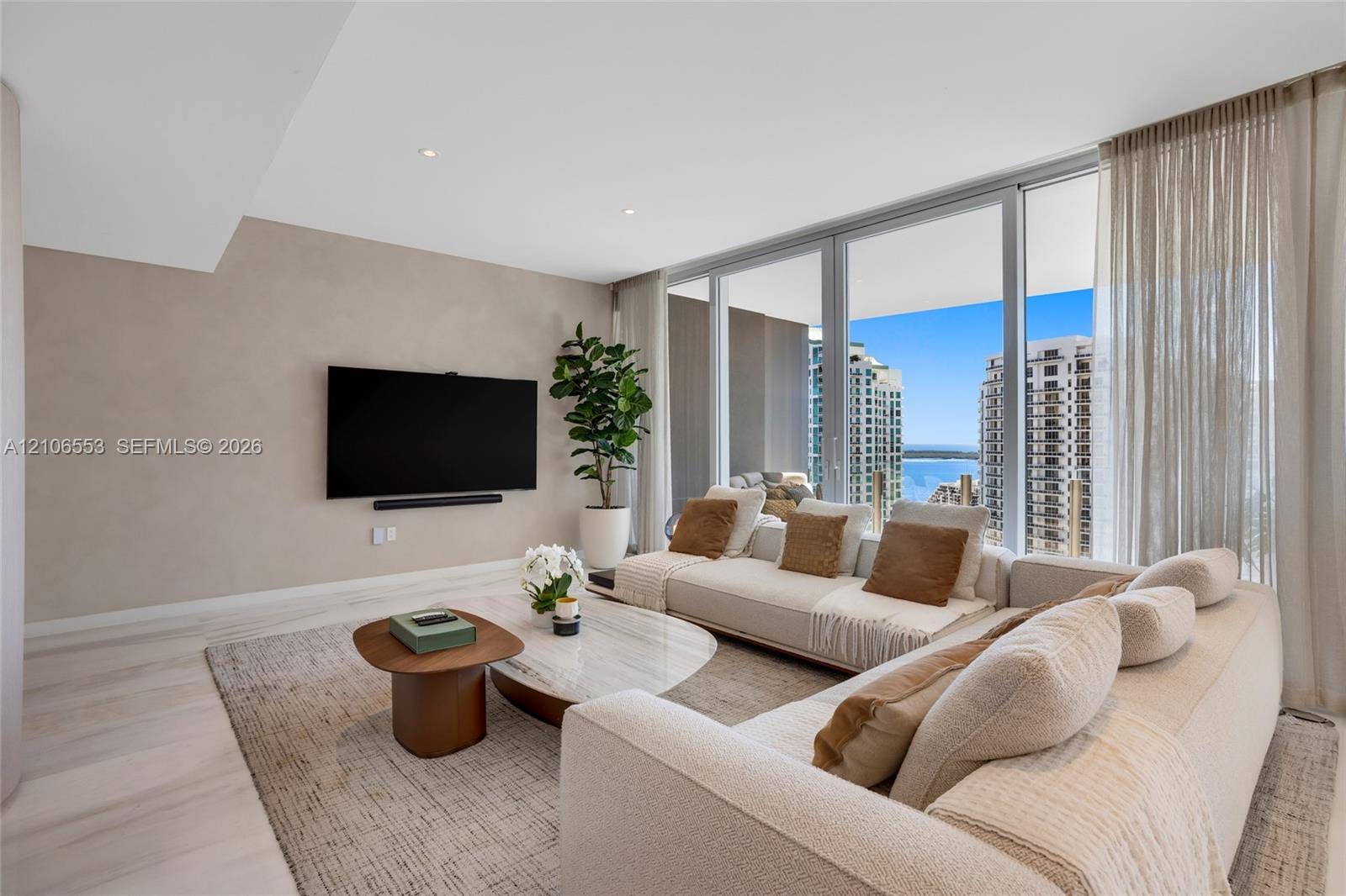 300 Biscayne Boulevard Way, #3002E, Miami, FL 33131 Floor-to-ceiling glass windows, recessed lighting, neutral wall finishes, and wood-finish flooring