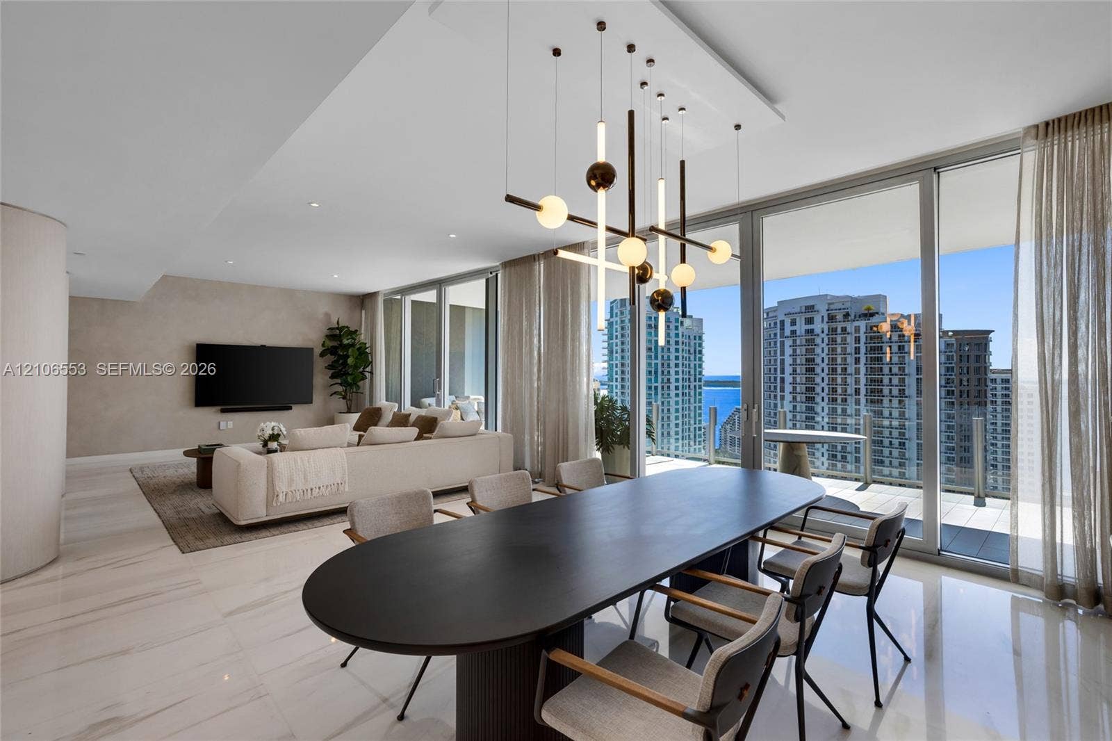 300 Biscayne Boulevard Way, #3002E, Miami, FL 33131 Floor-to-ceiling glass walls, polished stone flooring, custom multi-light chandelier, and recessed lighting