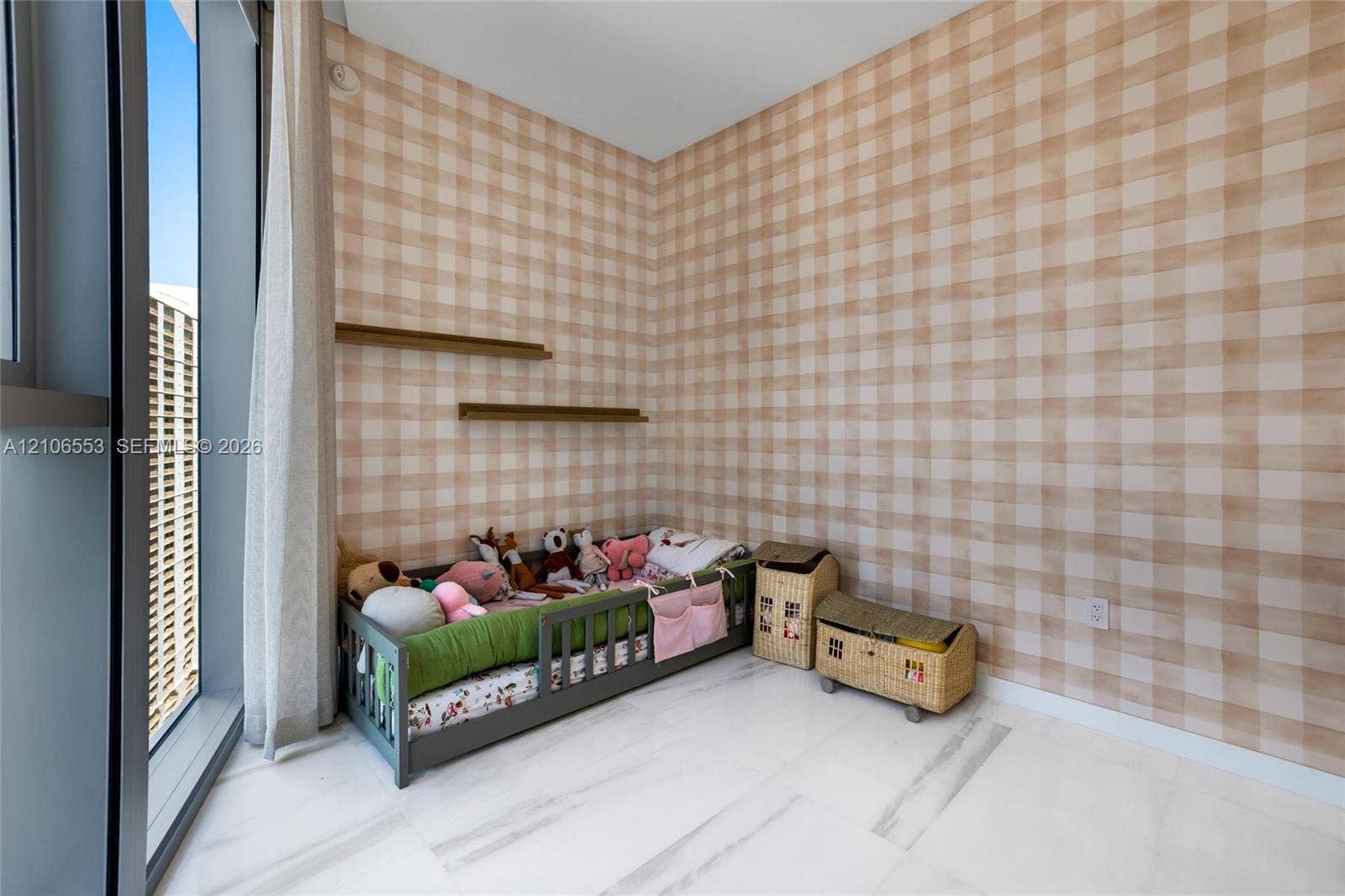 300 Biscayne Boulevard Way, #3002E, Miami, FL 33131 Floor-to-ceiling windows, white stone flooring, patterned wall covering, and dual wall-mounted floating shelves