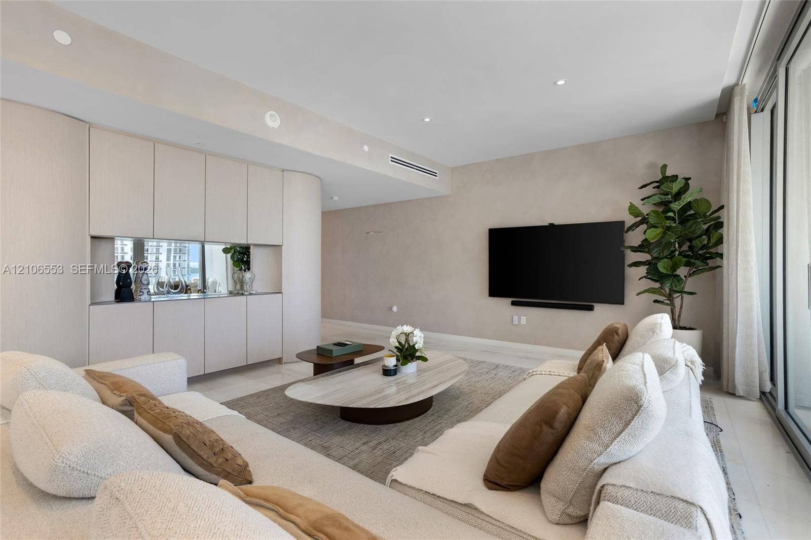 300 Biscayne Boulevard Way, #3002E, Miami, FL 33131 Custom floor-to-ceiling cabinetry with integrated mirror backsplash, recessed lighting, and large-format tile flooring
