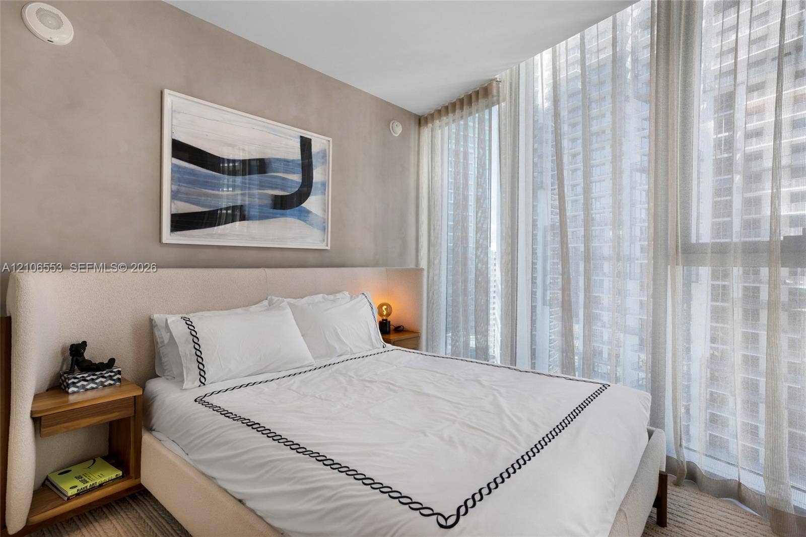 300 Biscayne Boulevard Way, #3002E, Miami, FL 33131 Full-height floor-to-ceiling windows with integrated drapery track, neutral textured wall finish, and wall-to-wall carpeting