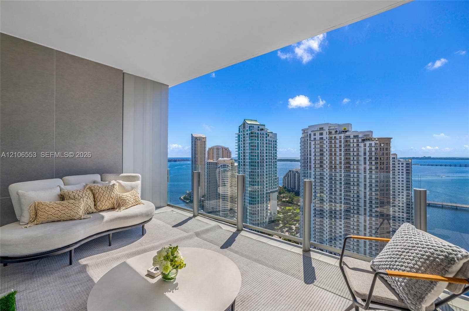 300 Biscayne Boulevard Way, #3002E, Miami, FL 33131 Covered balcony featuring glass railing and large-format tile flooring