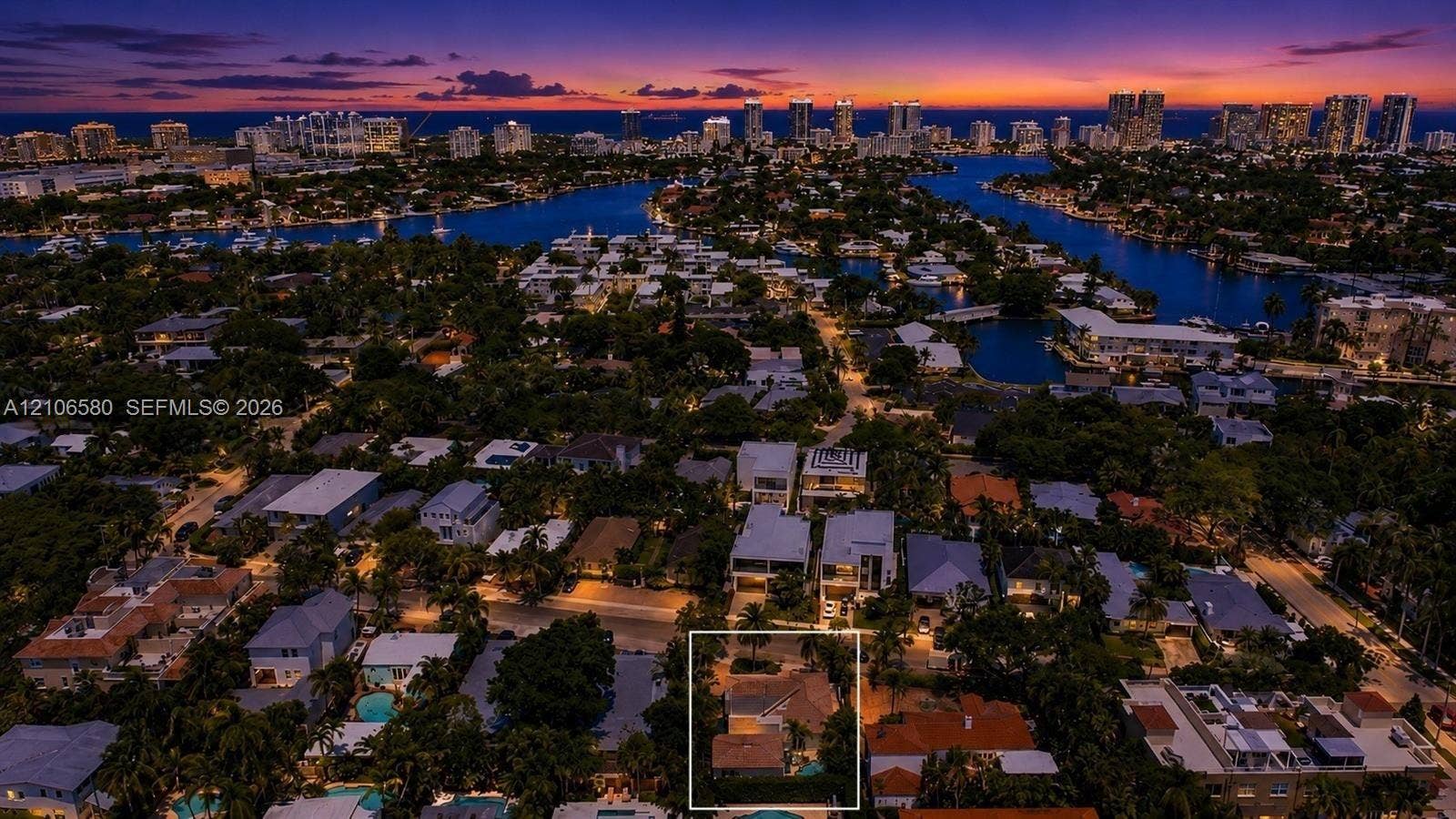 623 NE 17th Way, Fort Lauderdale, Fort Lauderdale, FL 33304 Aerial perspective of residential property featuring a pitched roof, mature landscaping, and a secluded rear yard