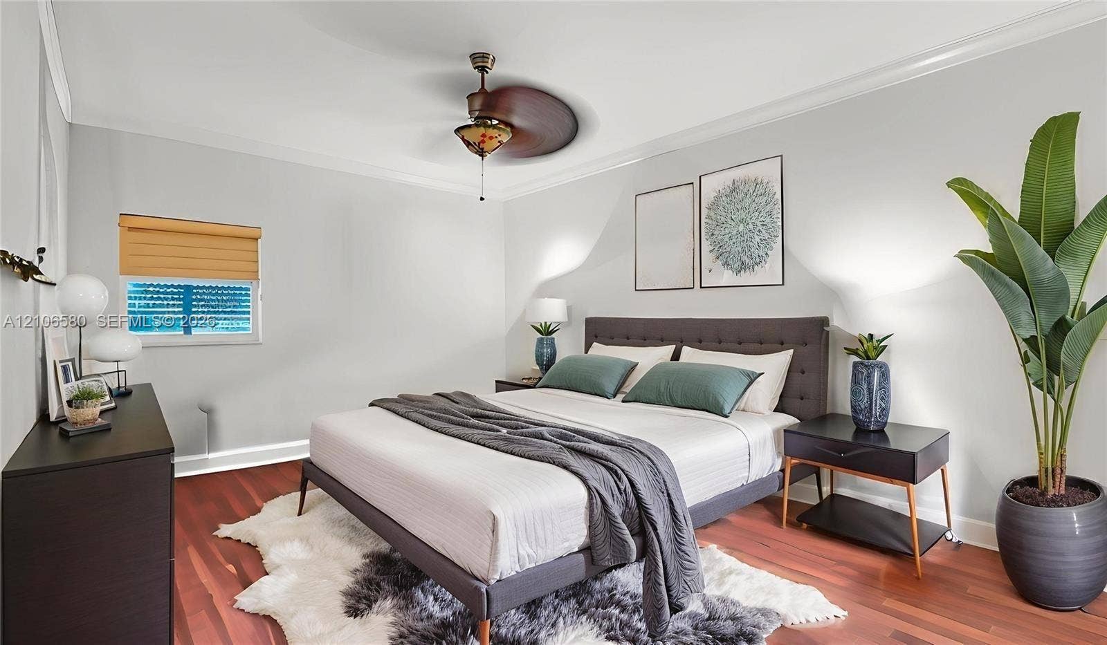 623 NE 17th Way, Fort Lauderdale, Fort Lauderdale, FL 33304 Room featuring wood-finish flooring, crown molding, and a decorative ceiling fan with integrated light fixture