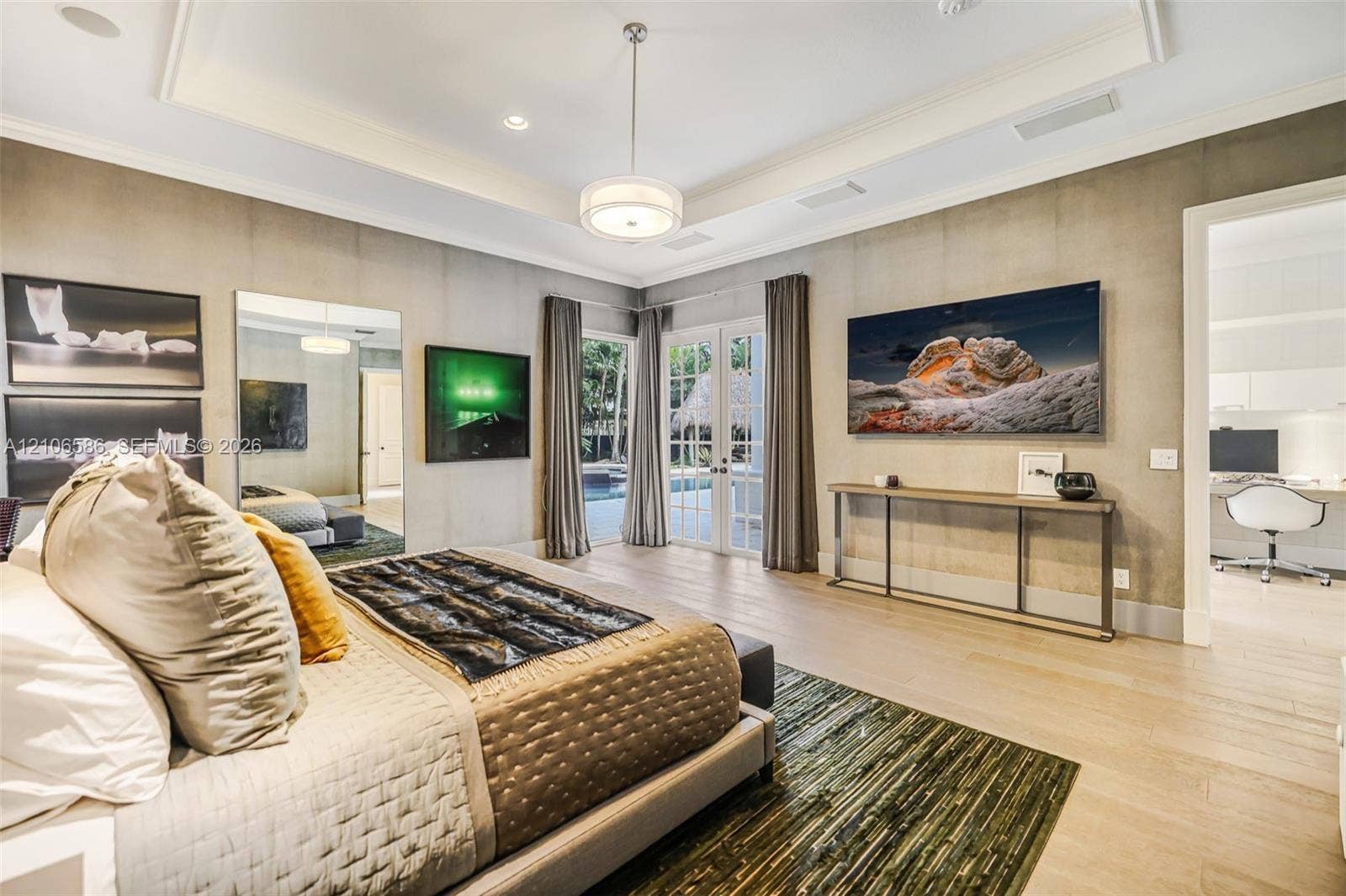 9325 SW 59th Place, Pinecrest, FL 33156 Tray ceiling with recessed lighting, wood-finish flooring, and glass-paned French doors