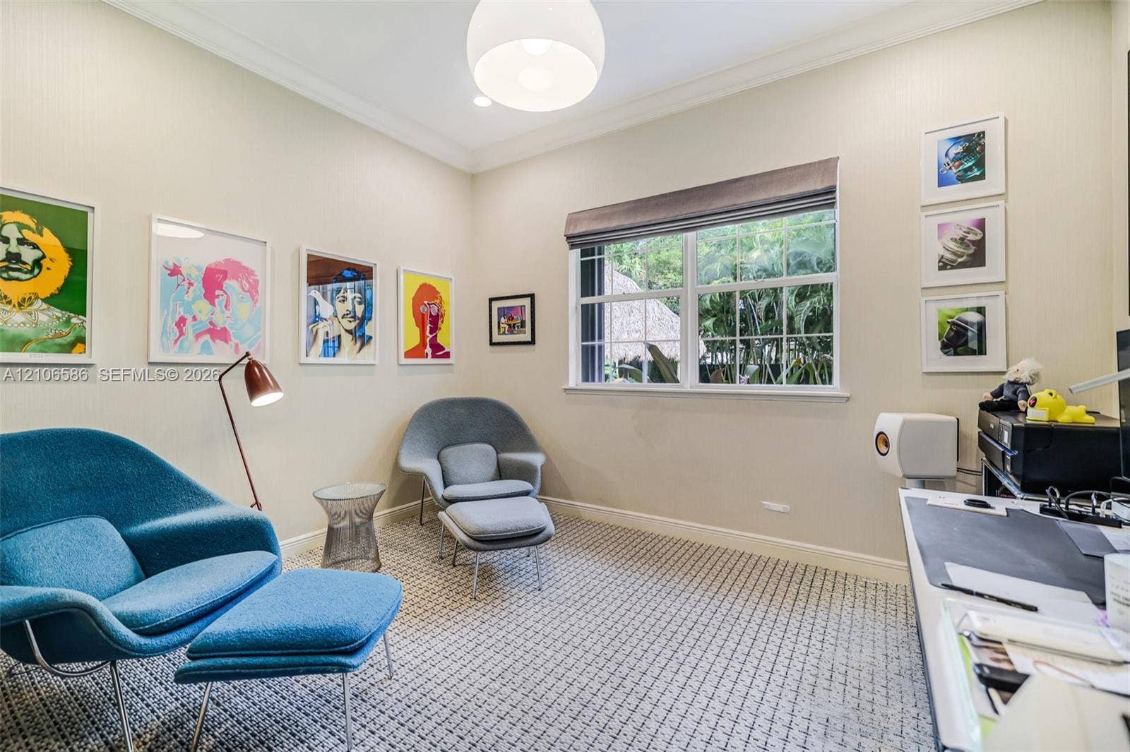 9325 SW 59th Place, Pinecrest, FL 33156 Neutral-toned walls featuring crown molding, patterned carpeting, recessed lighting, a globe pendant fixture, and a large multi-pane window