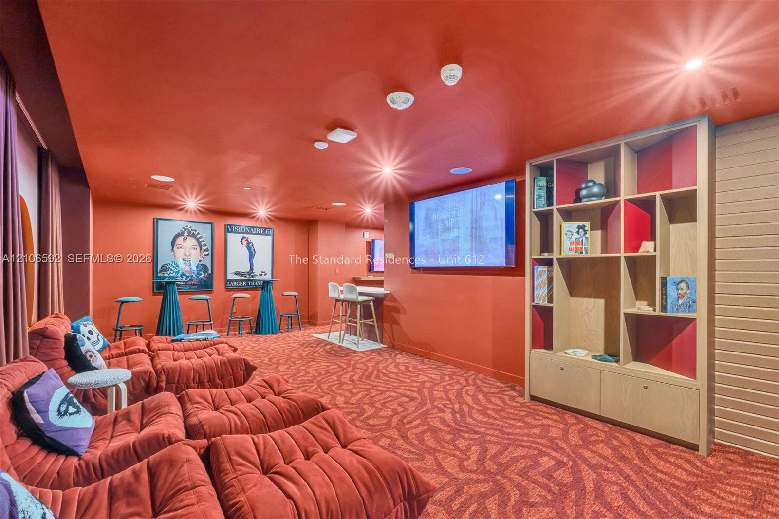 90 NE 32, #612, Miami, Miami, FL 33127 Built-in multi-level wood cabinetry, patterned carpeting, recessed ceiling lighting, and wall-mounted display screen