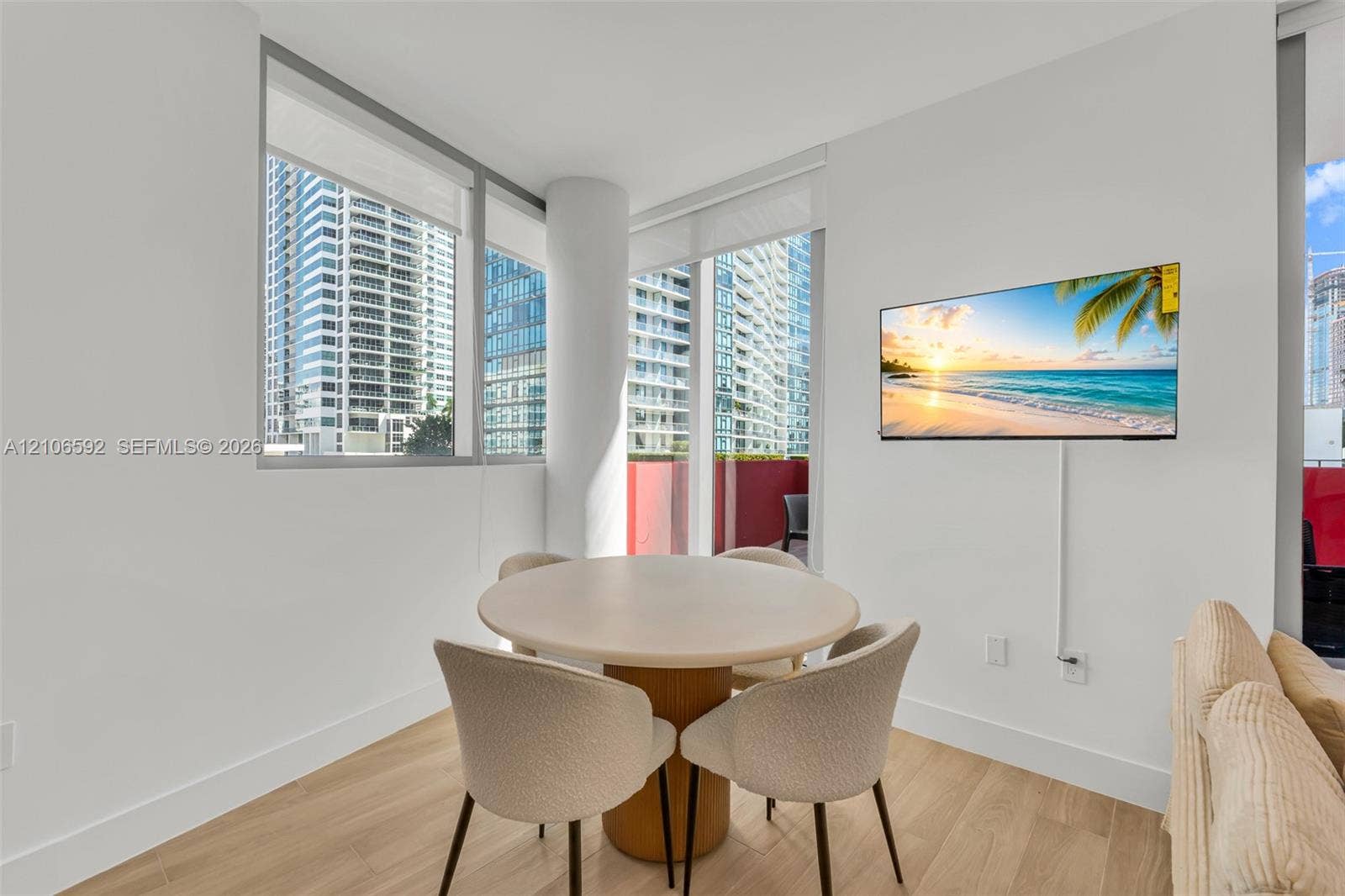 90 NE 32, #612, Miami, Miami, FL 33127 Floor-to-ceiling windows, wood-finish flooring, and structural column