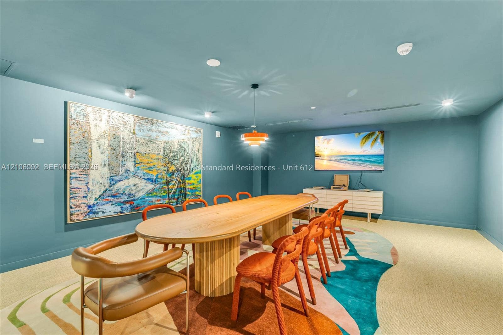 90 NE 32, #612, Miami, Miami, FL 33127 Multi-purpose space featuring recessed ceiling lighting, a modern tiered pendant fixture, and neutral wall-to-wall carpeting